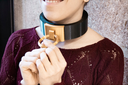woman with sleek nordic collar featuring a golden fastener with a ring
